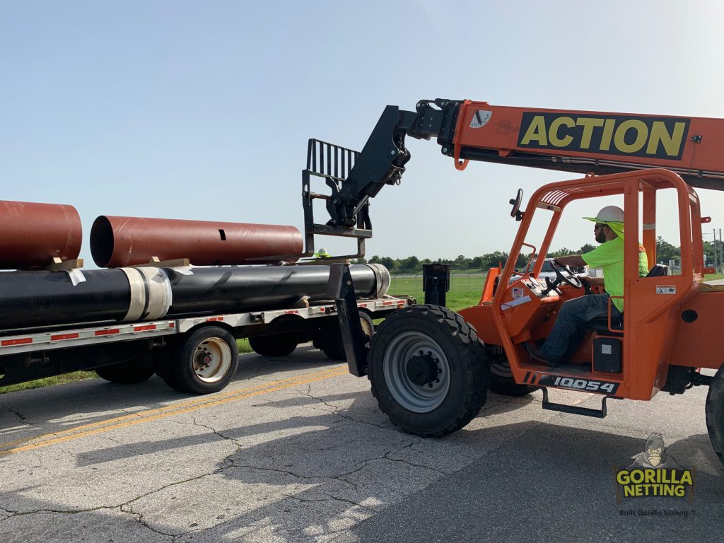 Poles & Caissons Being Delivered for the Netted Drone Enclosure Install at Embry-Riddle